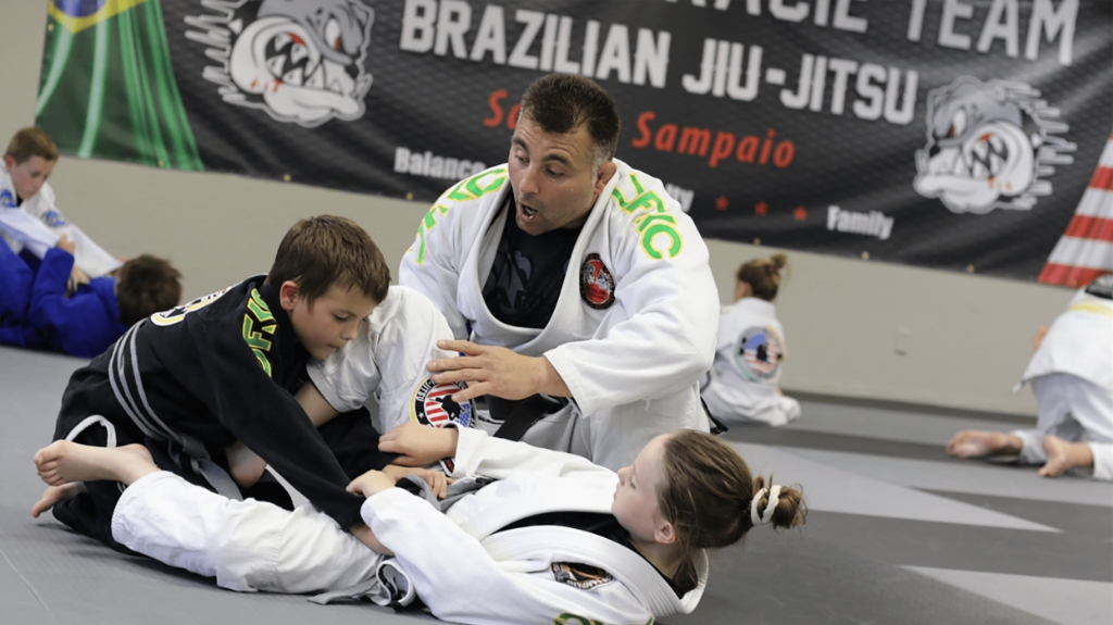 Coach Sandro Sampaio teaching kids BJJ at Carlson Gracie Oklahoma